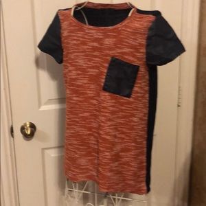 Women’s casual knit top with leather accents.